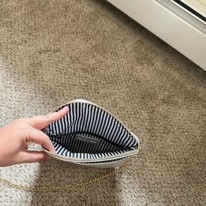 Silver cross body bag with gold accents